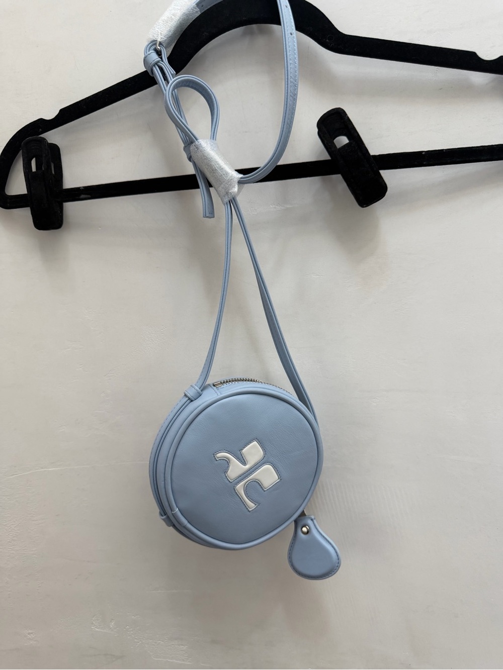 Courreges Light Blue Round Crossbody Bag with Silver Accent